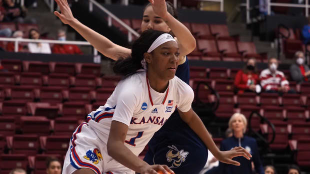 Mar 18, 2022; Stanford, California, USA; Kansas Jayhawks center Taiyanna Jackson (1) controls the ball against Georgia Tech Yellow Jackets center Nerea Hermosa (20) during the first quarter at Maples Pavilion. Mandatory Credit: Kelley L Cox-USA TODAY Sports